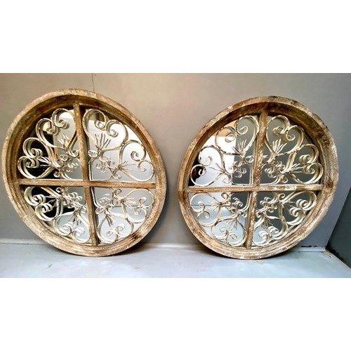 376 - ARCHITECTURAL CIRCULAR WALL MIRRORS, a pair, 72cm diam. x 5cm D, aged frames. (2)