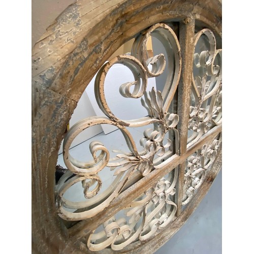 376 - ARCHITECTURAL CIRCULAR WALL MIRRORS, a pair, 72cm diam. x 5cm D, aged frames. (2)