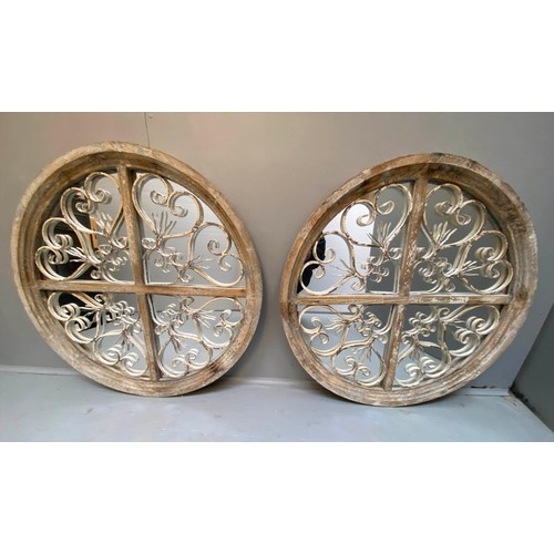 376 - ARCHITECTURAL CIRCULAR WALL MIRRORS, a pair, 72cm diam. x 5cm D, aged frames. (2)