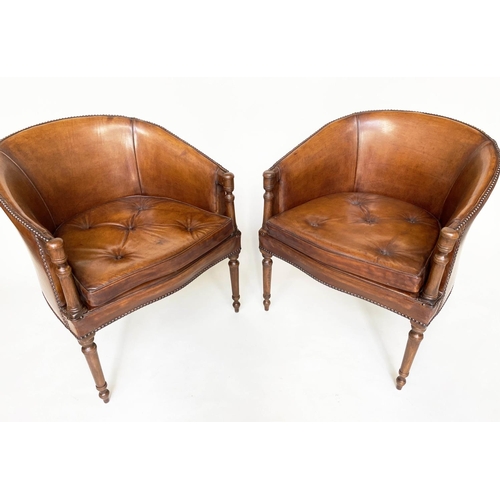 101 - TUB ARMCHAIRS, a pair, Club style brass studded tan leather with button cushion seat and rounded bac... 
