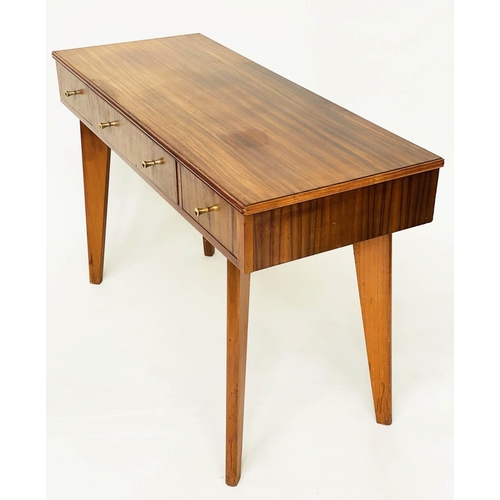 273 - WRITING TABLE, 1970s teak and Indian laurel with three frieze drawers and tapering out swept support... 