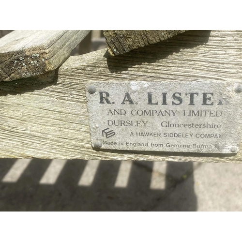 411 - LISTER GARDEN BENCH, silvery weathered teak of slatted construction with flat top arms by R A Lister... 