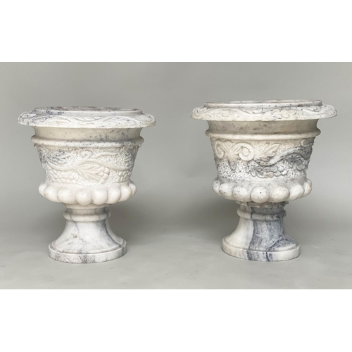 104 - MARBLE URNS, a pair, carved urns with ram's mask and swag foliate decoration, 40cm W x 40cm H. (2)