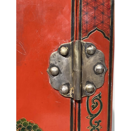 110 - SIDE CABINET, Chinese scarlet lacquered and gilt Chinoiserie decorated with two doors, 79cm W x 110c... 