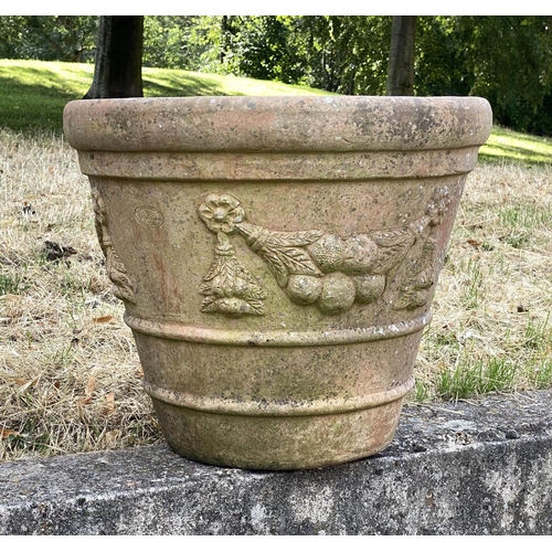 117 - GARDEN TERRACOTTA PLANTERS, a set of three, large weathered terracotta with fruit decoration, 57cm W... 