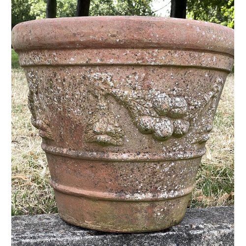 117 - GARDEN TERRACOTTA PLANTERS, a set of three, large weathered terracotta with fruit decoration, 57cm W... 