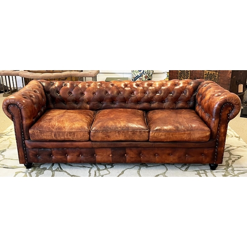 136 - CHESTERFIELD SOFA, three seater, buttoned and studded tan leather, 210cm W.