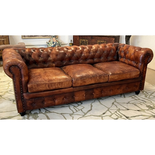 136 - CHESTERFIELD SOFA, three seater, buttoned and studded tan leather, 210cm W.