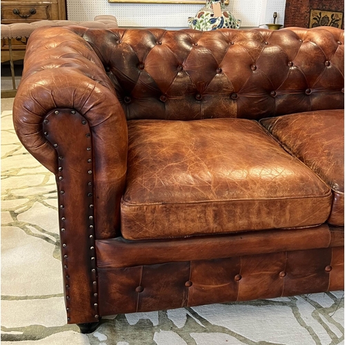 136 - CHESTERFIELD SOFA, three seater, buttoned and studded tan leather, 210cm W.