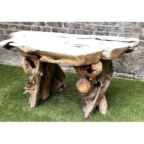 165 - GARDEN 'ROOT' TABLE, well weathered tree section with raw edge and knarled root base, 136cm W x 66cm... 