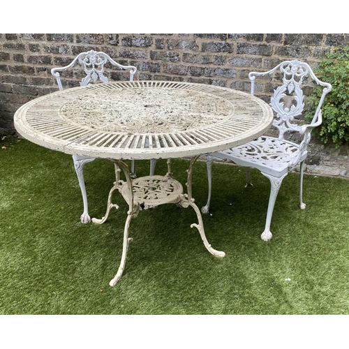 168 - GARDEN TABLE AND CHAIRS, weathered painted cast aluminium circular pierced with two matching chairs,... 