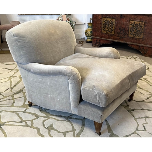 194 - HOWARD STYLE ARMCHAIR, velvet upholstered with tapered front supports and castors, 86cm W