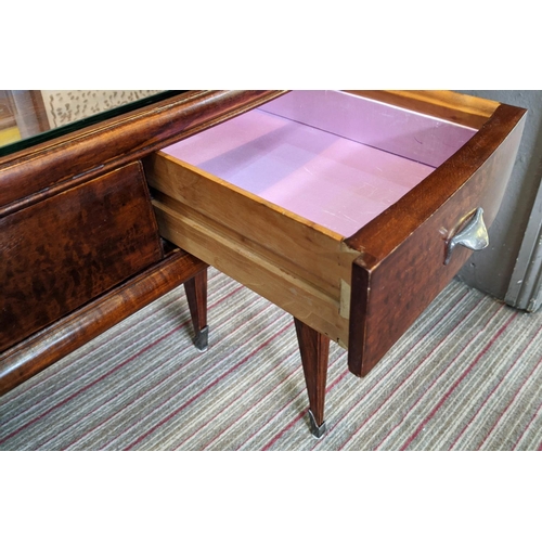 195 - BIJOUTERIE TABLE, 115cm W x 76cm H x 47cm D Art Deco manner with a glass top above three drawers on ... 