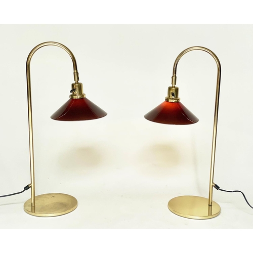 288 - DESK LAMPS, a pair, arched tubular brass with circular bases and conical glass shades, 70cm H. (2)