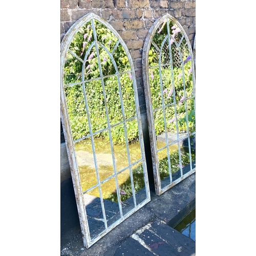 369 - ARCHITECTURAL WALL MIRRORS, a pair, 160cm high, 67cm wide, Gothic arched design, aged metal frames. ... 