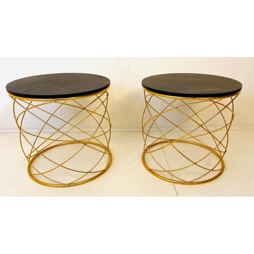 375 - SIDE TABLES, a pair, 45cm H x 46cm diam., 1970s Italian style, gilt metal bases, ebonised circular w... 