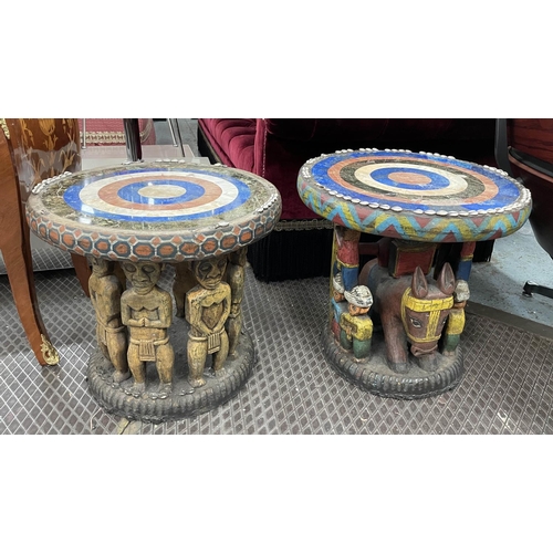 425 - SIDE TABLES, two, carved wood with figural bases and round lapis lazuli with marble and cowrie shell... 