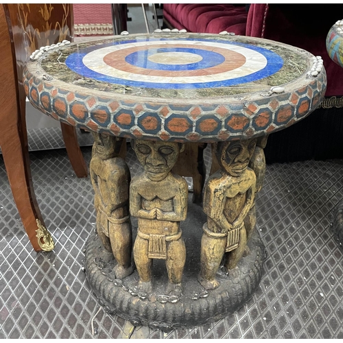 425 - SIDE TABLES, two, carved wood with figural bases and round lapis lazuli with marble and cowrie shell... 