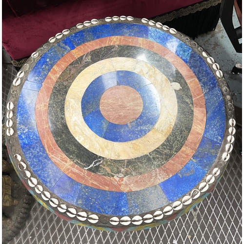 425 - SIDE TABLES, two, carved wood with figural bases and round lapis lazuli with marble and cowrie shell... 