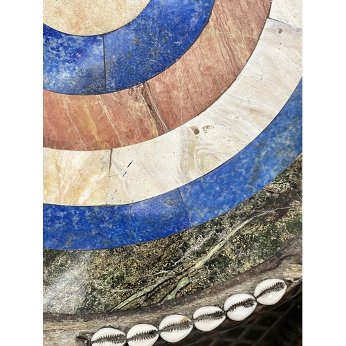 425 - SIDE TABLES, two, carved wood with figural bases and round lapis lazuli with marble and cowrie shell... 