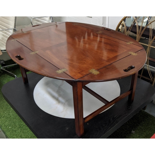 150 - ARTHUR BRETT STYLE BUTLERS TRAY TABLE, mahogany removable top with hinged handles, oval glass cover,... 