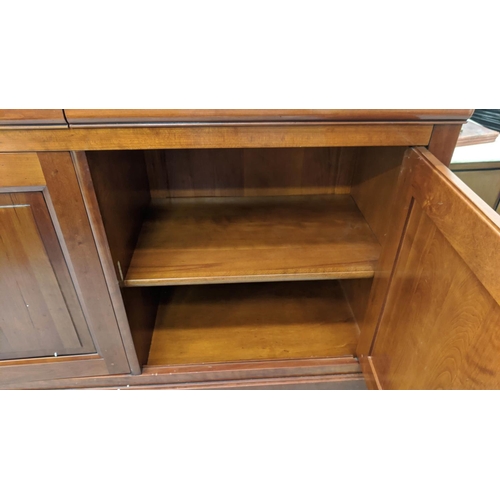 345 - GRANGE SIDEBOARD, 209cm L x 98cm H x 55cm D with three panelled doors enclosing shelves.