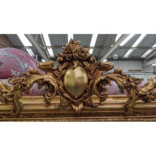 391 - OVERMANTEL WALL MIRROR, 150cm x 170cm, gilt frame, putti detail to surmount.