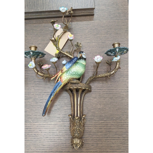 397 - WALL SCONCES, a pair, 60cm x 43cm x 12cm, in the form of parrots amongst floral and foliate display,... 