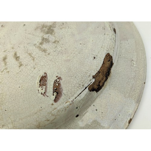 5 - A DELFT TIN GLAZED EARTHEN WARE CHARGER, inscribed '1697' depicting a galloping horse, 49.5cm diam.