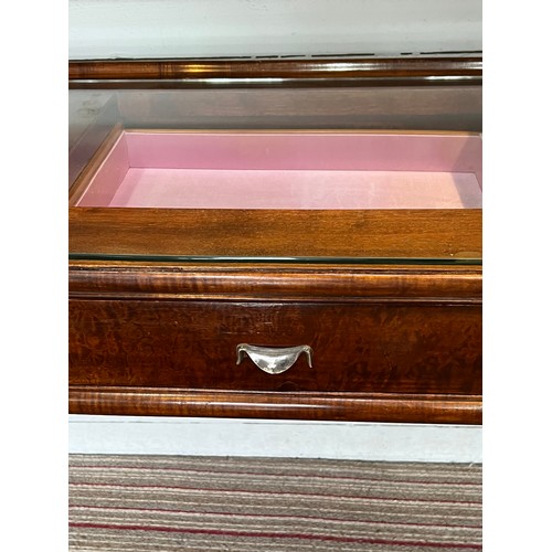 195 - BIJOUTERIE TABLE, 115cm W x 76cm H x 47cm D Art Deco manner with a glass top above three drawers on ... 