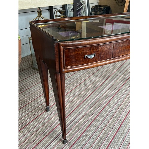 195 - BIJOUTERIE TABLE, 115cm W x 76cm H x 47cm D Art Deco manner with a glass top above three drawers on ... 