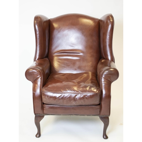 197 - WING ARMCHAIR, 107cm H x 84cm, Georgian style brown leather.