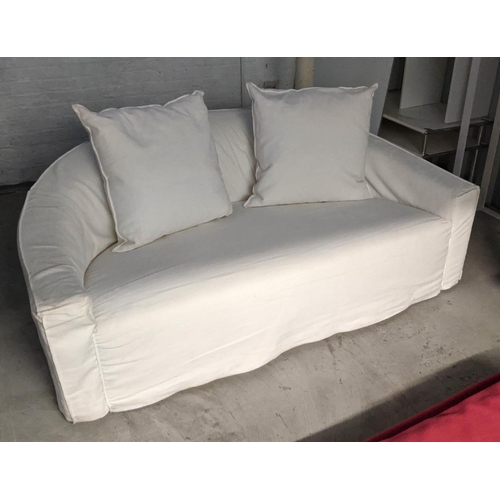 418 - POLIFORM SOFA, of curved form, in a loose white cover, 180cm W.