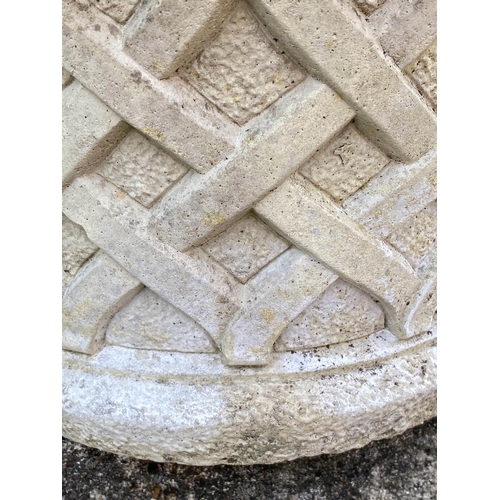 261 - GARDEN PLANTERS, a pair, well weathered reconstituted stone, circular with basket weave sides and sc... 