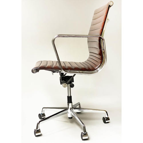 107 - REVOLVING DESK CHAIR, Charles and Ray Eames inspired with ribbed tan leather seat revolving and recl... 