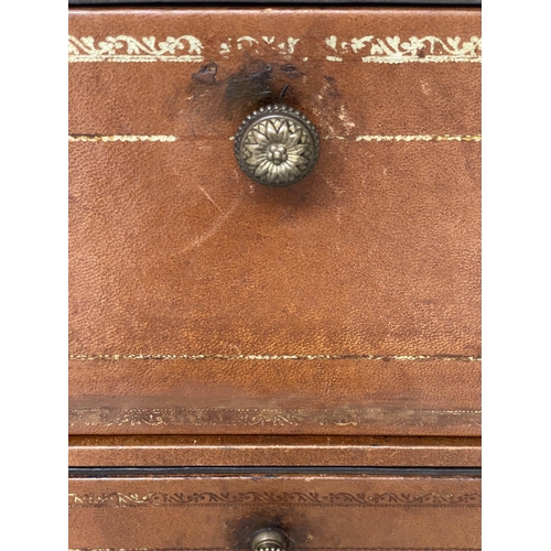 108 - LEATHER CHESTS, a pair, gilt 1970s tooled tan leather, each with two box drawers above a deep filing... 