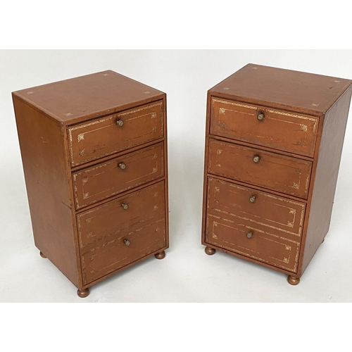 108 - LEATHER CHESTS, a pair, gilt 1970s tooled tan leather, each with two box drawers above a deep filing... 