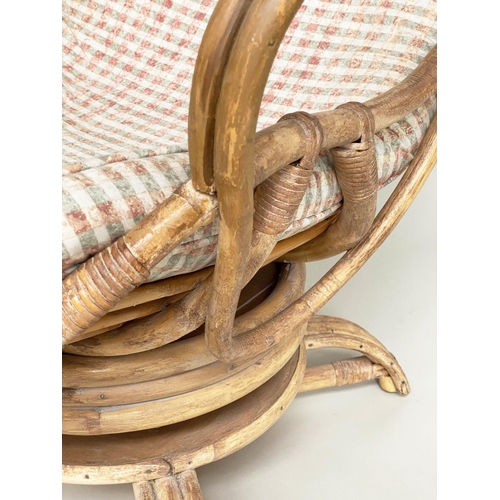 120 - TERRACE/VERANDAH ARMCHAIR, mid 20th century rattan framed and cane bound revolving and reclining (ro... 