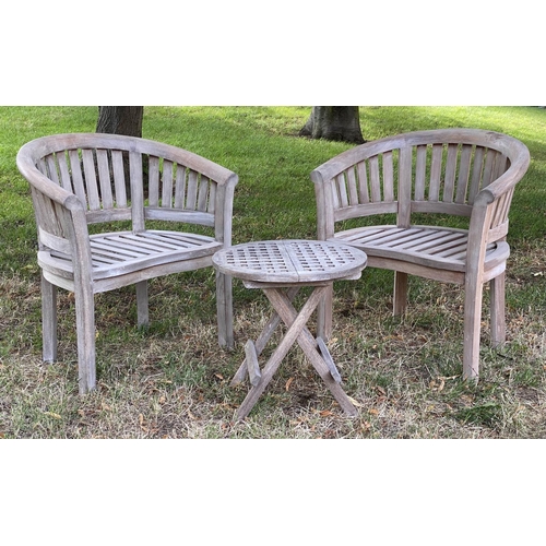 131 - GARDEN CURVED ARMCHAIRS, a pair, weathered teak each slatted with rounded backs, together with an un... 