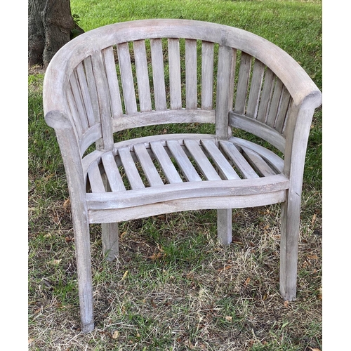 131 - GARDEN CURVED ARMCHAIRS, a pair, weathered teak each slatted with rounded backs, together with an un... 