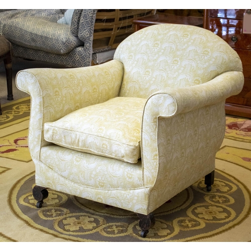 154 - ARMCHAIR, 80cm H x 85cm W, late 19th/early 20th century in patterned yellow fabric on steel castors.