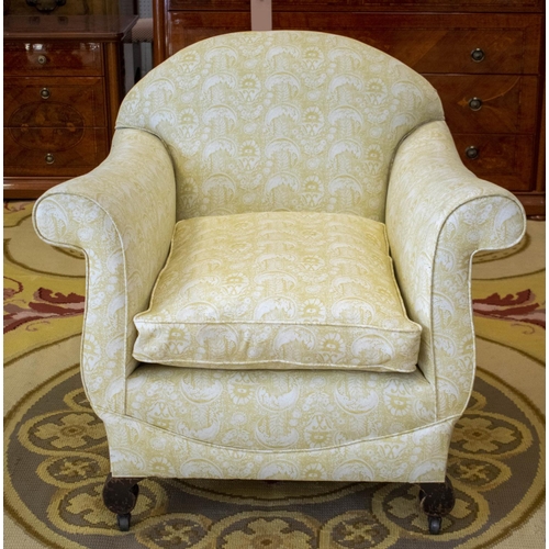 154 - ARMCHAIR, 80cm H x 85cm W, late 19th/early 20th century in patterned yellow fabric on steel castors.