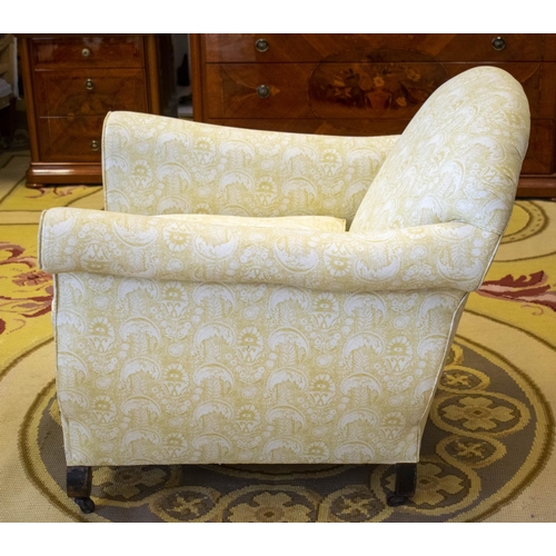 154 - ARMCHAIR, 80cm H x 85cm W, late 19th/early 20th century in patterned yellow fabric on steel castors.