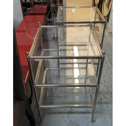 186 - OCCASIONAL TABLES, a pair, square three-tier form, steel frames, castor terminals, 72cm H x 44cm W.