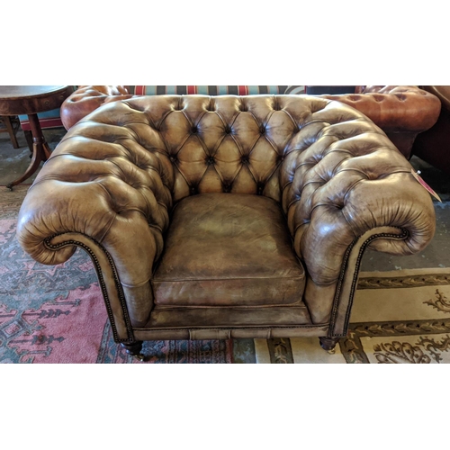 201 - CHESTERFIELD ARMCHAIR, 133cm W x 85cm D, from Fleming Howland, in buttoned brown leather.