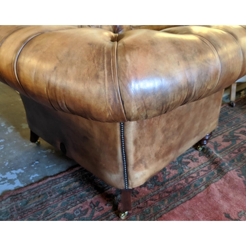 201 - CHESTERFIELD ARMCHAIR, 133cm W x 85cm D, from Fleming Howland, in buttoned brown leather.