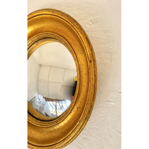 401 - CONVEX WALL MIRRORS, a set of twelve, Regency style, gilt frames, various sizes, largest measuring 2... 