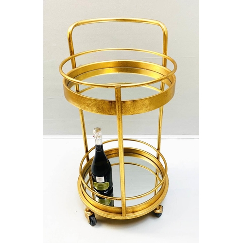 410 - COCKTAIL TROLLEY, 77cm high, 42cm diameter, 1960s French style, mirrored glass tiers, gilt metal fra... 