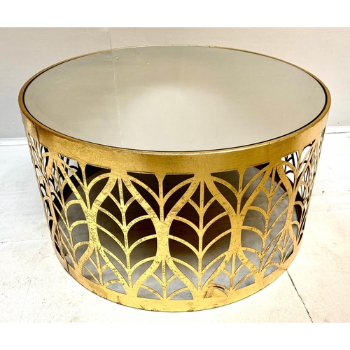 412 - LOW TABLE, 40cm high, 74cm diameter, 1970s Italian style, gilt metal, mirrored glass top, leaf pierc... 