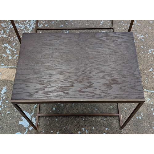 441 - NEST OF TABLES, ebonised ash veneered tops, bronze effect frames, graduated size, 50cm H x 55cm W x ... 